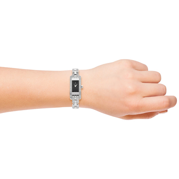 Reloj Corum para dama en acero inoxidable.
