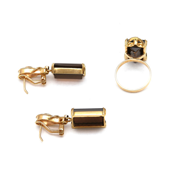 Juego de anillo y aretes diseño especial con topacios ahumados y circonias en oro amarillo 14 kilates.