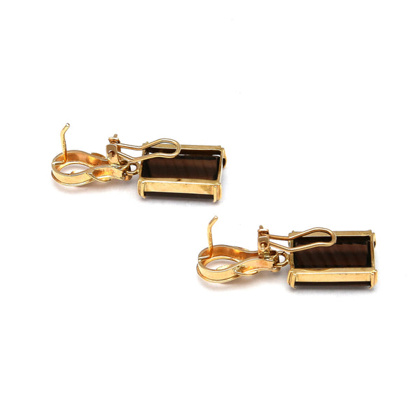 Juego de anillo y aretes diseño especial con topacios ahumados y circonias en oro amarillo 14 kilates.