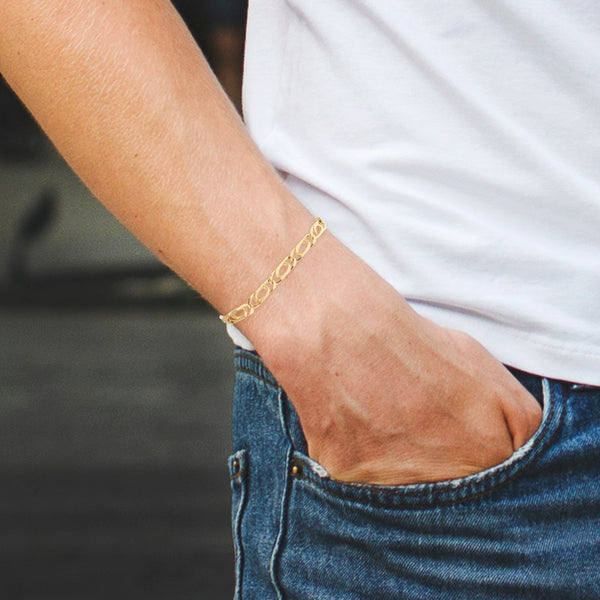 Pulsera eslabón nudo egipcio en oro amarillo 18 kilates.