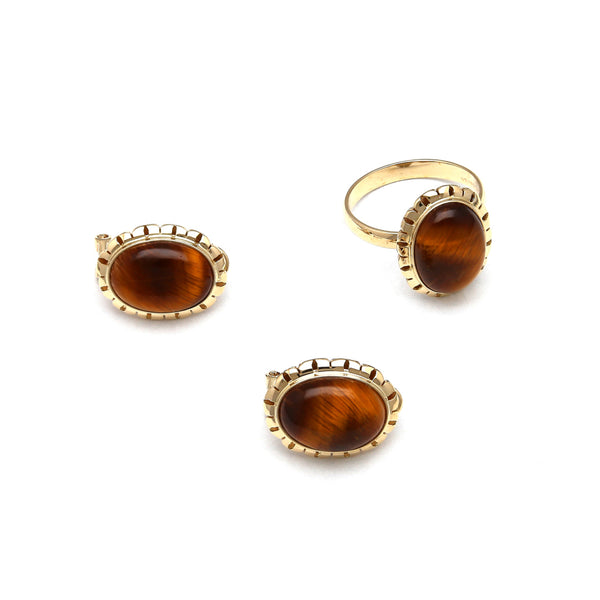 Juego de anillo y aretes calados con ojo de tigre en oro amarillo 14 kilates.