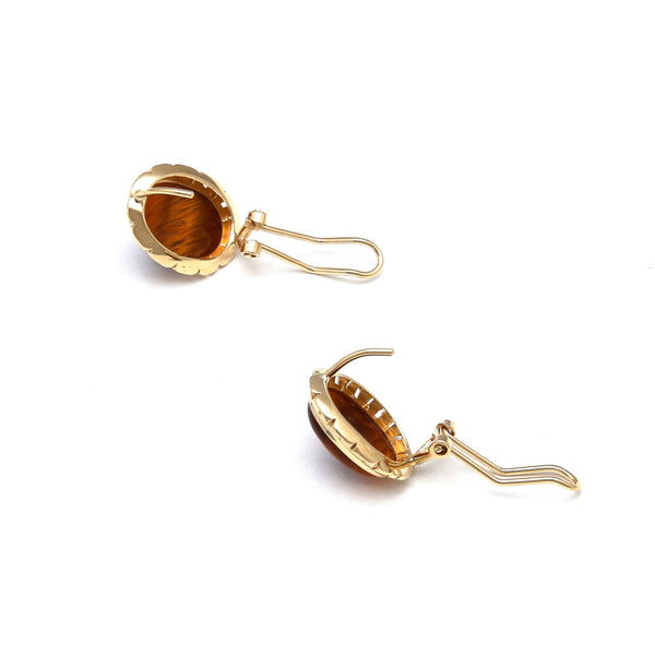 Juego de anillo y aretes calados con ojo de tigre en oro amarillo 14 kilates.
