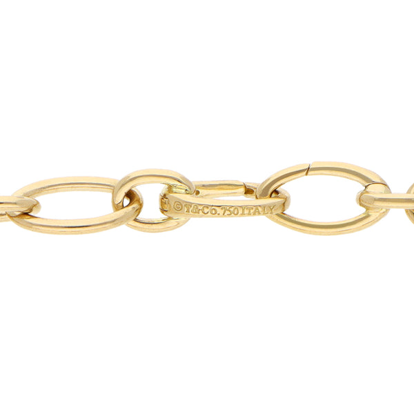 Pulsera eslabón combinado firma Tiffany & Co. en oro amarillo 18 kilates.