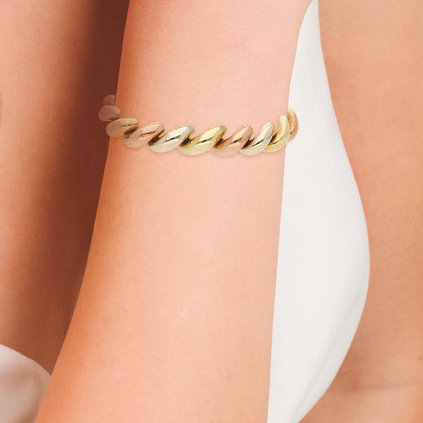 Pulsera eslabón articulado en oro tres tonos 14 kilates.