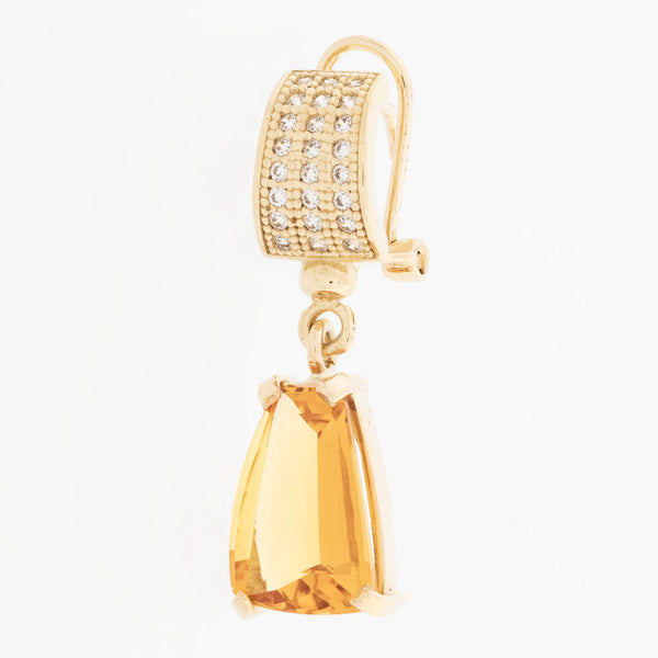 Aretes estilizados con citrinos y circonias en oro amarillo 14 kilates.