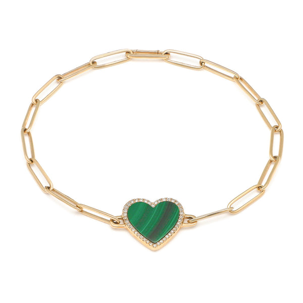 Pulsera eslabón cruzado con aplicación motivo corazón de diamantes y malaquita en oro amarillo 14 kilates.