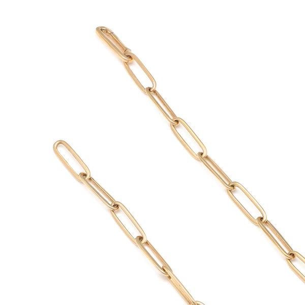 Pulsera eslabón cruzado con aplicación motivo corazón de diamantes y malaquita en oro amarillo 14 kilates.