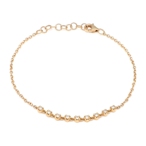 Pulsera eslabón cruzado con aplicaciones de diamantes en oro amarillo 14 kilates.