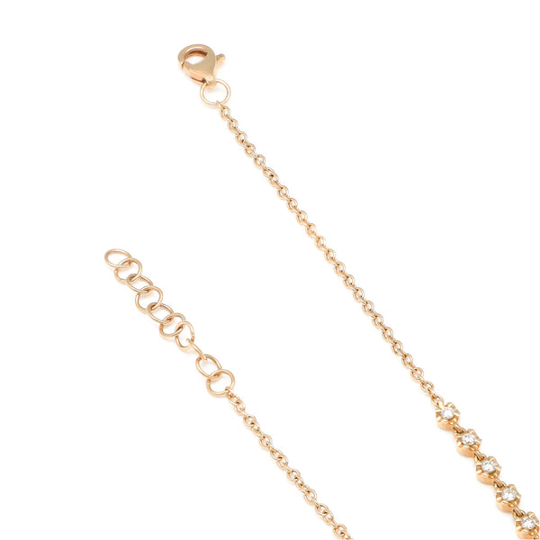 Pulsera eslabón cruzado con aplicaciones de diamantes en oro amarillo 14 kilates.