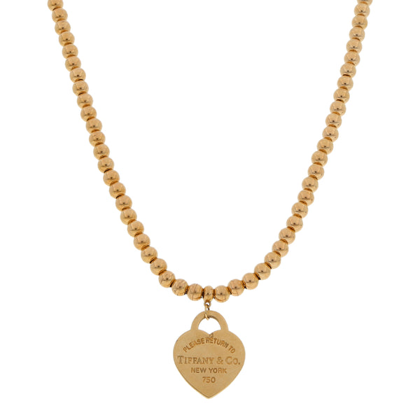 Gargantilla eslabón boleado con colgante motivo corazón firma Tiffany & Co. en oro amarillo 18 kilates.