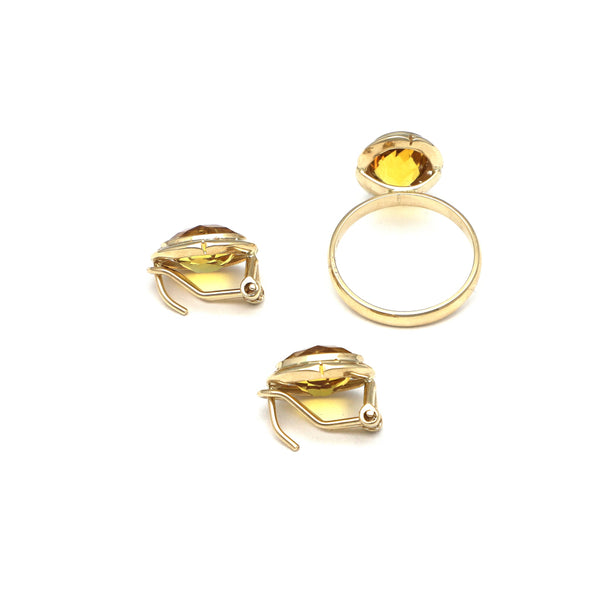 Juego de anillo y aretes calados con citrinos en oro amarillo 14 kilates.