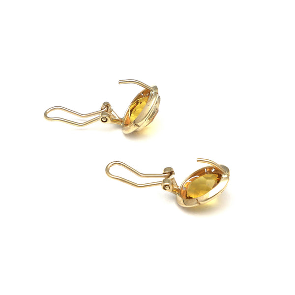 Juego de anillo y aretes calados con citrinos en oro amarillo 14 kilates.