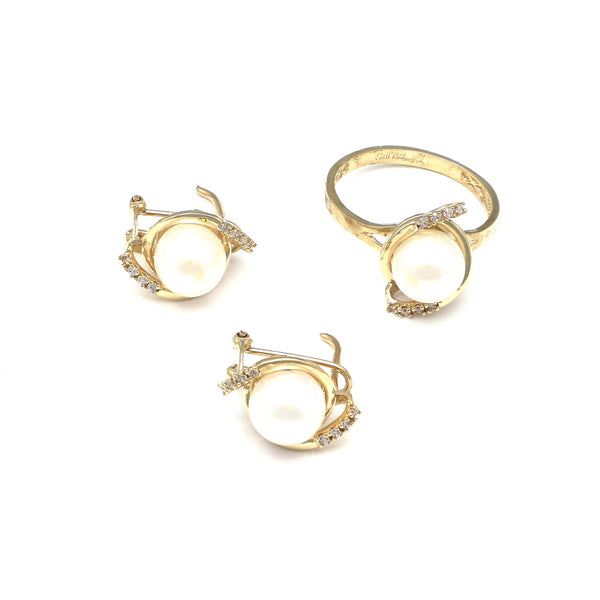 Juego de anillo y aretes diseño especial con perla y circonias en oro amarillo 14 kilates.