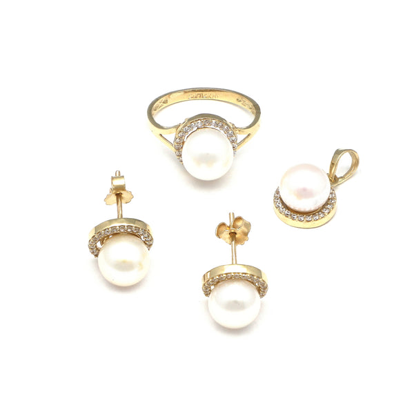 Juego de anillo, dije y broqueles diseño especial con perla y circonias en oro amarillo 14 kilates.