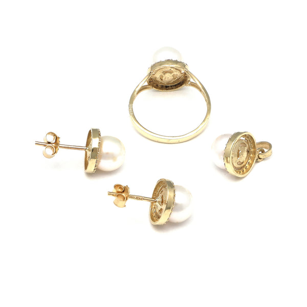 Juego de anillo, dije y broqueles diseño especial con perla y circonias en oro amarillo 14 kilates.