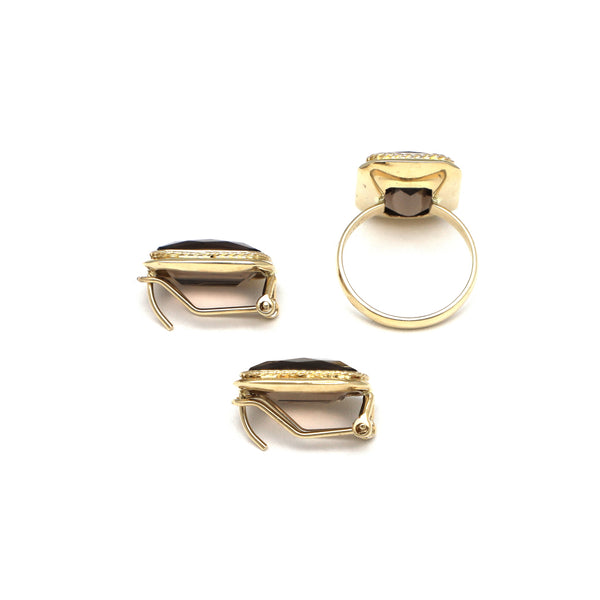 Juego de anillo y aretes diseño especial con topacios ahumados en oro amarillo 14 kilates.