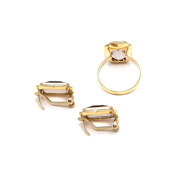 Juego de anillo y aretes diseño especial con topacios ahumados en oro amarillo 14 kilates.