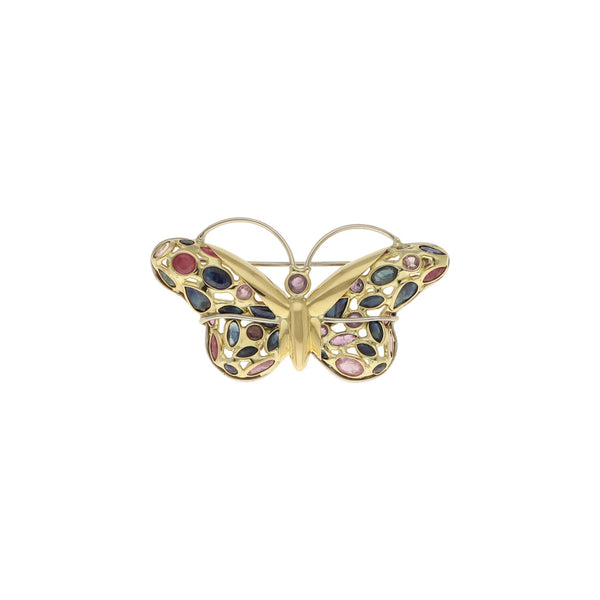 Prendedor diseño especial motivo mariposa con rubíes y zafiros en oro dos tonos 18 kilates.