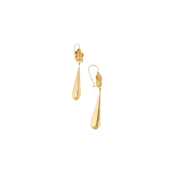 Aretes huecos motivo floral en oro amarillo 18 kilates.