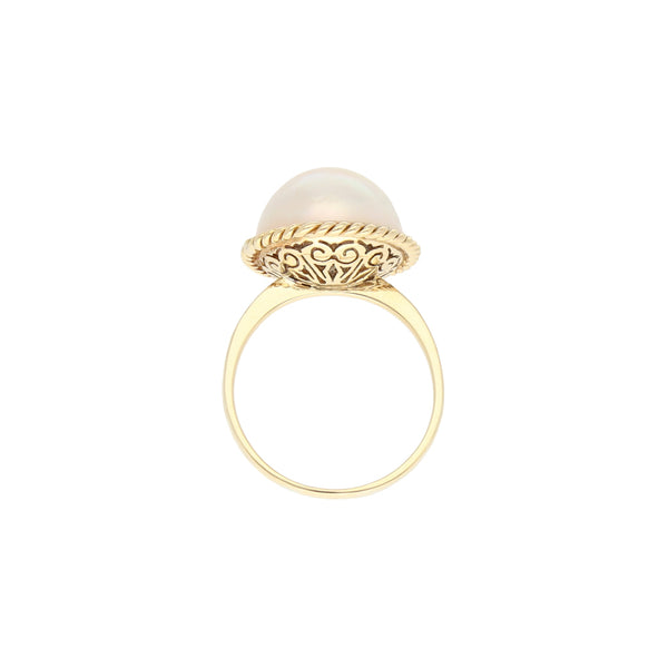 Anillo diseño especial con perla en oro amarillo 14 kilates.