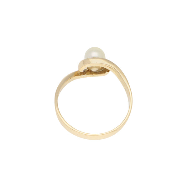 Anillo diseño especial con perla en oro amarillo 14 kilates.