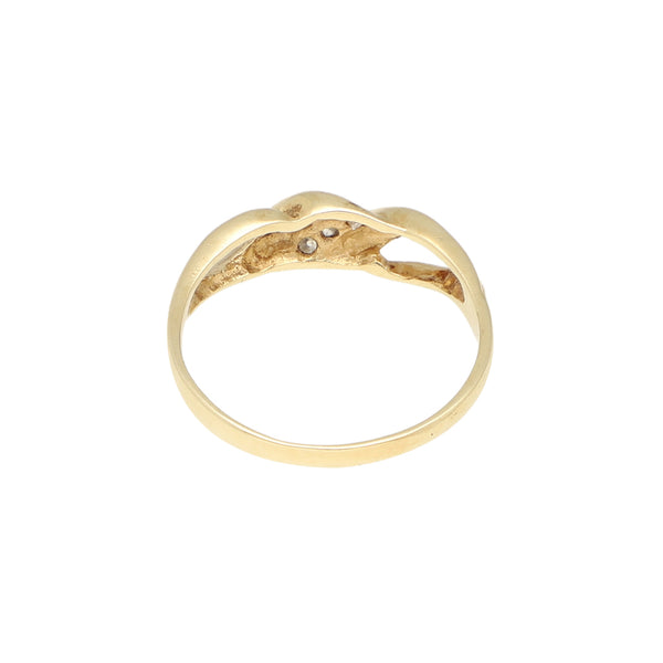 Anillo calado con circonias en oro amarillo 14 kilates.