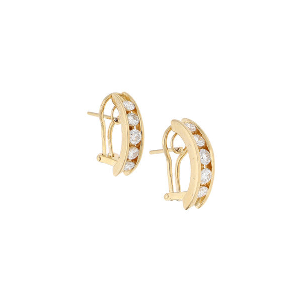 Aretes estilizados con diamantes en oro amarillo 14 kilates.