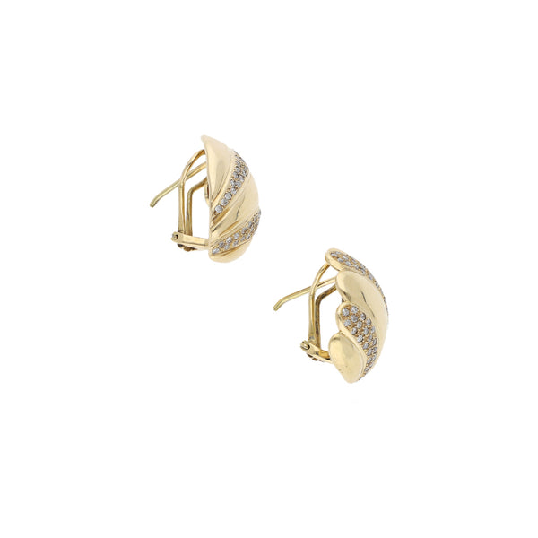 Aretes estilizados con diamantes en oro amarillo 14 kilates.