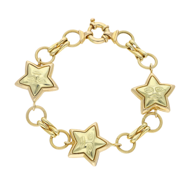 Pulsera eslabón combinado con aplicaciones motivo estrellas en oro amarillo 14 kilates.