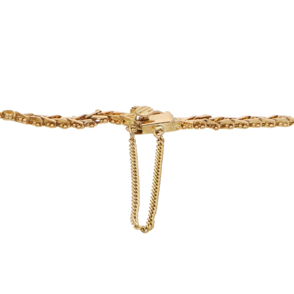 Pulsera eslabón boleado en oro amarillo 18 kilates.