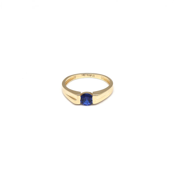 Anillo diseño especial con circonia azul en oro amarillo 14 kilates.