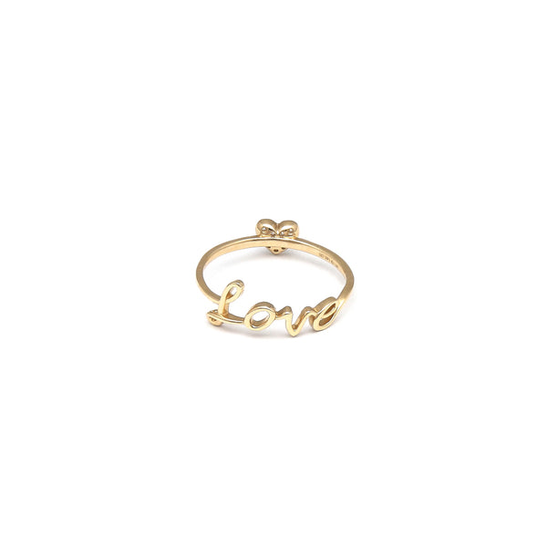 Anillo diseño especial motivo letras y corazón con circonias en oro amarillo 14 kilates.