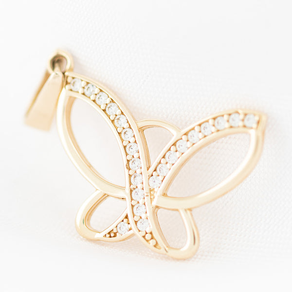 Dije diseño especial motivo mariposa con circonias en oro amarillo 14 kilates.