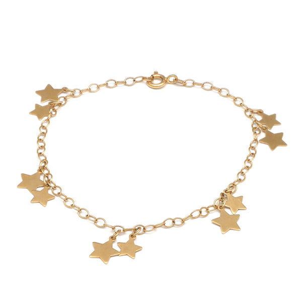 Pulsera eslabón cruzado con colgantes motivo estrellas en oro amarillo 14 kilates.