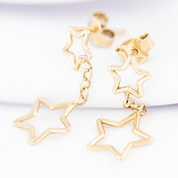 Broqueles diseño especial motivo estrellas en oro amarilo 14 kilates.