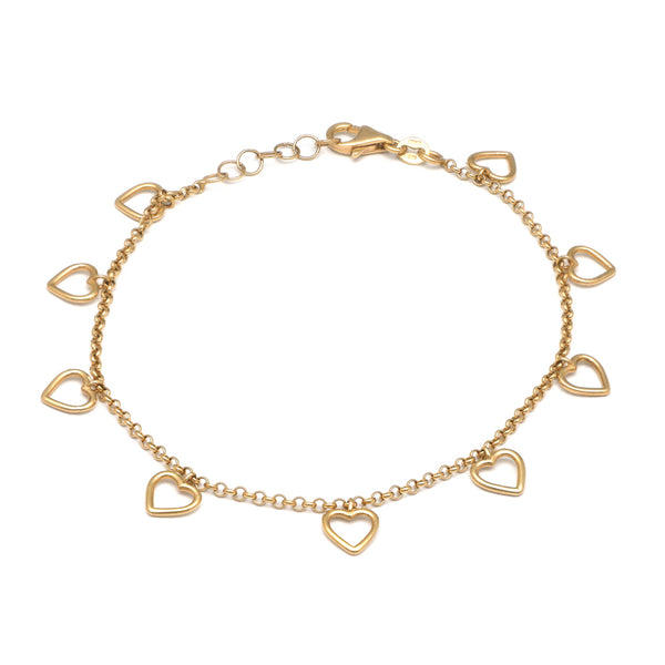 Pulsera eslabón cruzado con colgantes motivo corazones en oro amarillo 14 kilates.