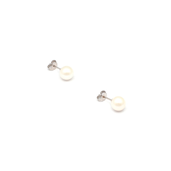 Aretes diseño especial con perlas en oro blanco 14 kilates.