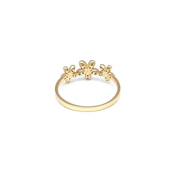 Anillo estilizado motivo floral con circonias en oro amarillo 14 kilates.