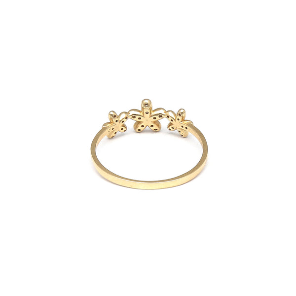 Anillo estilizado motivo floral con circonias en oro amarillo 14 kilates.