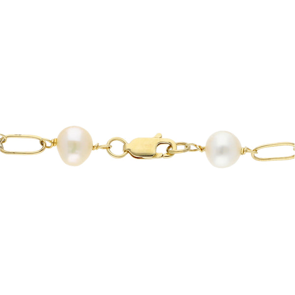 Pulsera eslabón combinado con perlas en oro amarillo 14 kilates.