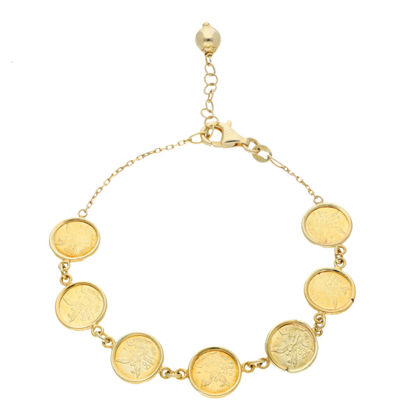 Pulsera eslabón cruzado con aplicaciones motivo monedas en oro amarillo 14 kilates.