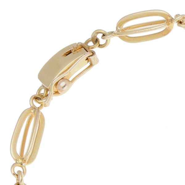 Pulsera eslabón combinado en oro amarillo 14 kilates.