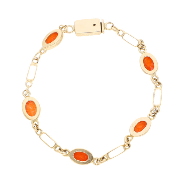 Pulsera eslabón combinado con coral en oro amarillo 14 kilates.