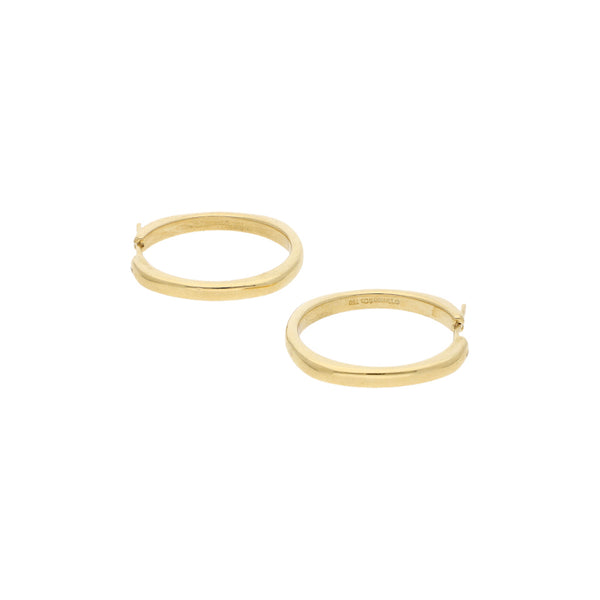 Arracadas lisas firma Tiffany & Co. en oro amarillo 18 kilates.