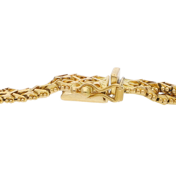 Pulsera eslabón boleado en oro amarillo 18 kilates.