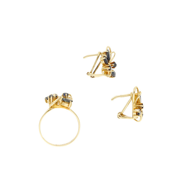 Juego de anillo y aretes diseño especial con zafiros en oro amarillo 14 kilates.