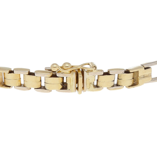 Pulsera eslabón articulado en oro dos tonos 14 kilates.