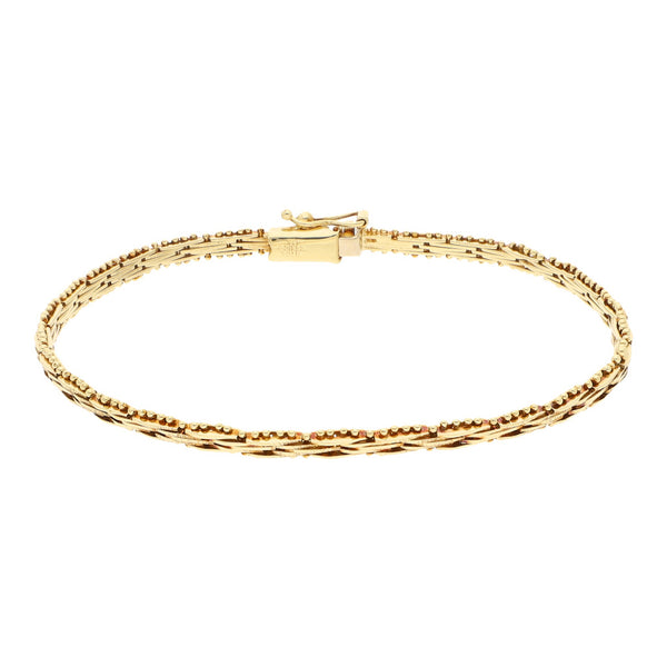 Pulsera eslabón boleado en oro amarillo 14 kilates.