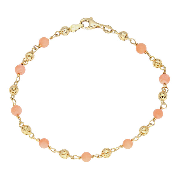 Pulsera eslabón combinado con aplicaciones motivo esferas de coral en oro amarillo 14 kilates.