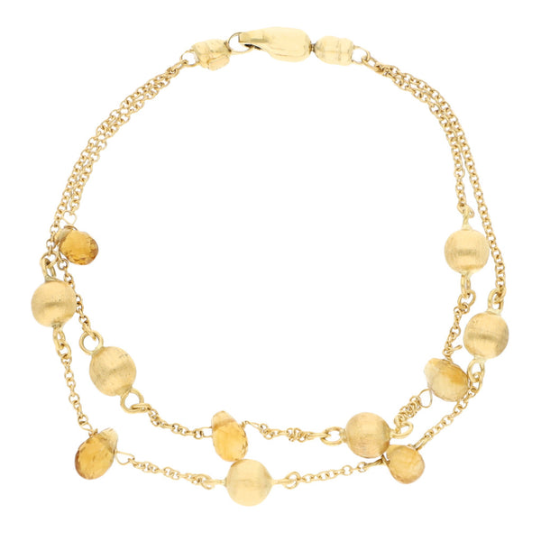 Pulsera eslabón cruzado dos hilos con aplicaciones de esferas y sinteticos en oro amarillo 18 kilates.